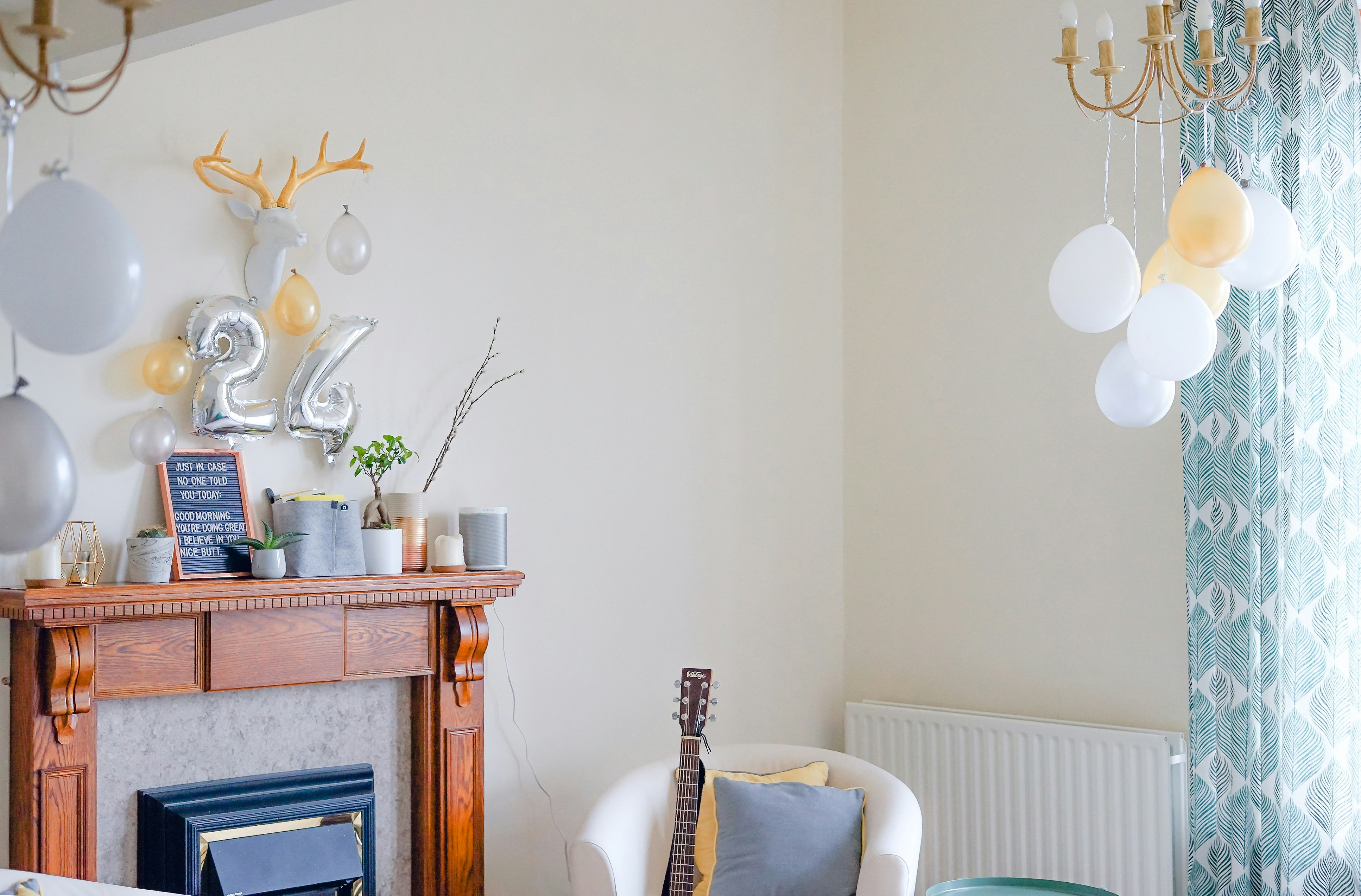 white tub chair near wooden fireplace